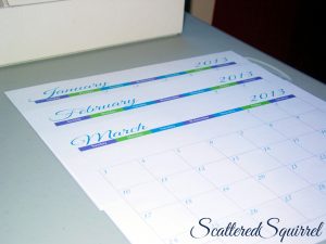 Image printed monthly calendars on a table.