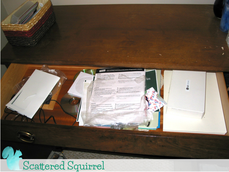 Messy drawer of paper and more office supplies that never made the transition into my new office space.