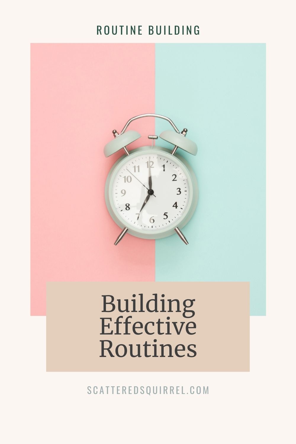 grey alarm clock, with bells and striker ontop, on a pink and blue background.