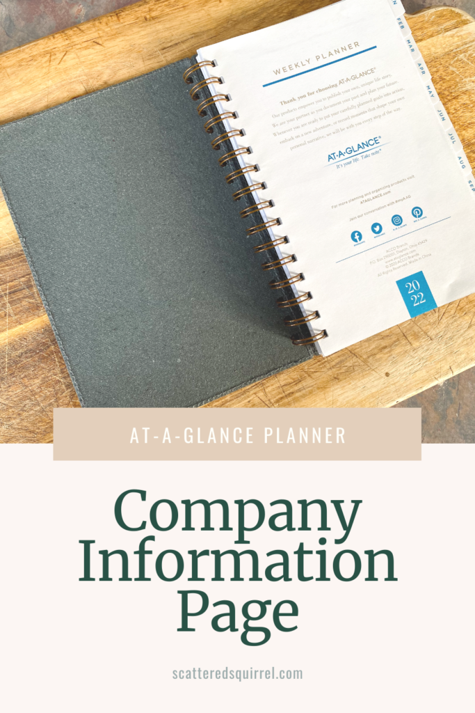 An open planner sits on a cutting board. It's open to the first page which has information about the planner and the company that made it, At-A-Glance.