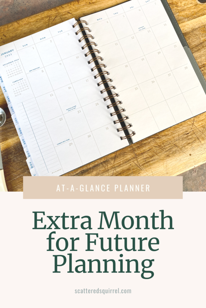 A planner lying open on a cutting board to show a monthly calendar spread over two pages. On the left hand side it say January 2023 in blue text followed by small monthly calendars for December 2022 and February 2023. Under those is section for a checklist. The calendar grid is outlined in a medium brown and the date number match. The text is all in a blue, serif font so it pops on the page.