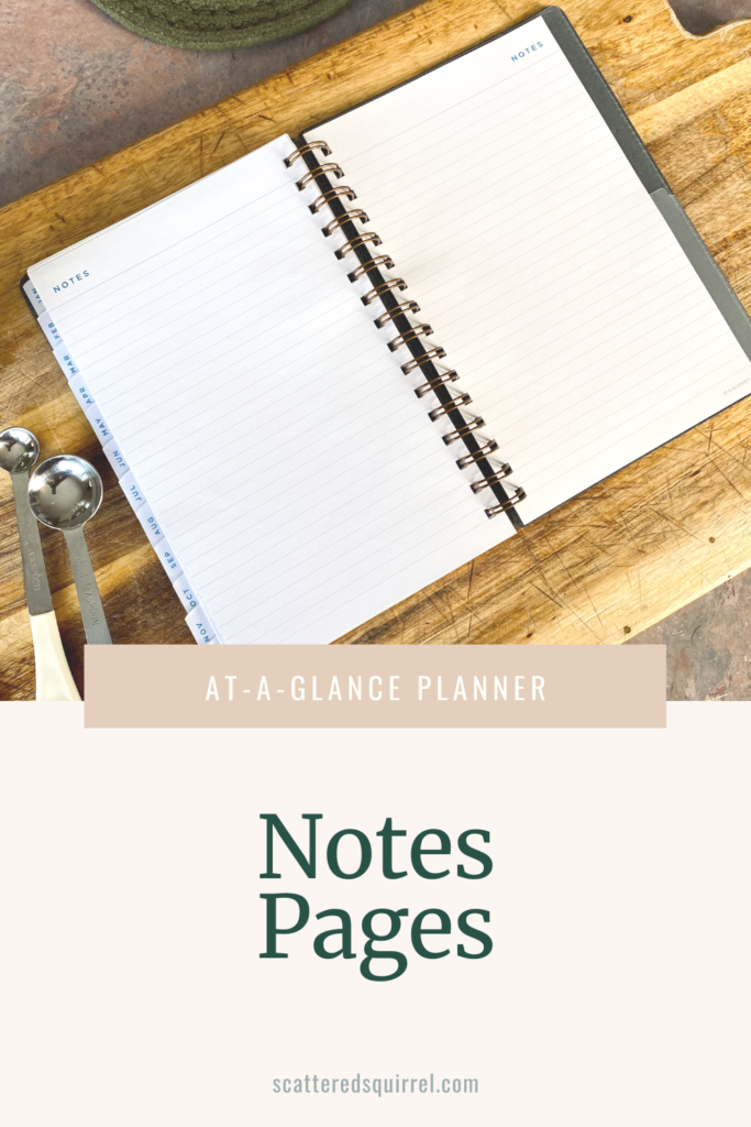 A planner is lying open on a cutting board. The pages that are shown both say Notes at the top in blue font and the pages are lined with light brown lines.