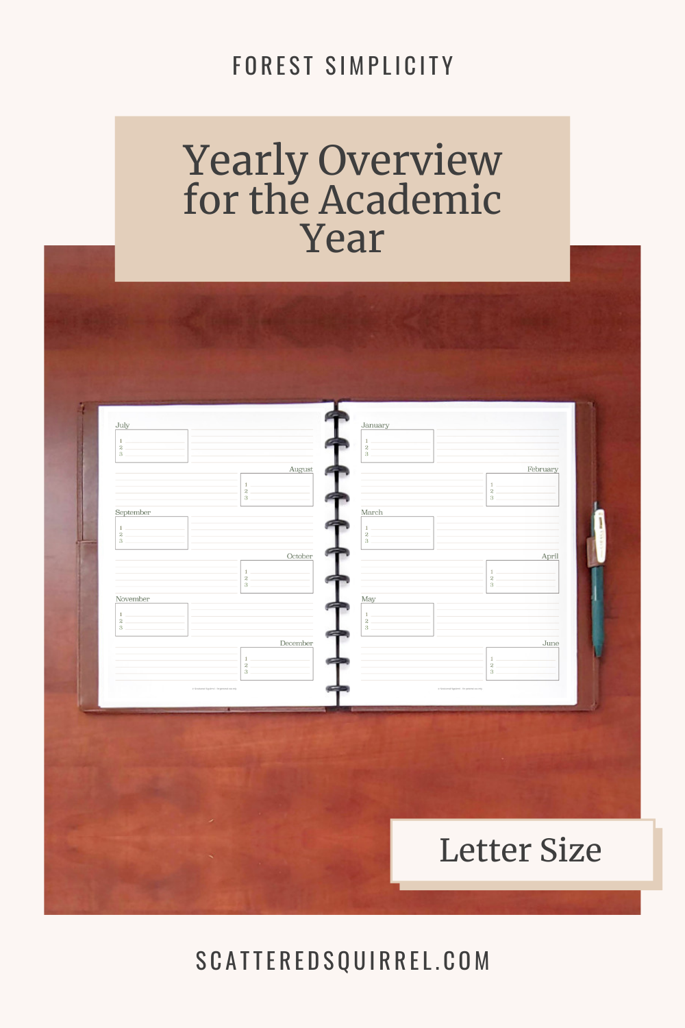 Image Reads - Yearly Overview for the Academic Year and shows an A5 planner open on a wooden desk. The pages are divided into 6 sections each for the months starting in July. Each section has room for top three goals or priorites and a notes section.