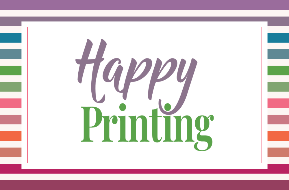 This image has a reverse rainbow striped background. On top of the background is a white rectangle with a green border inset from the edges. Then in colourful fonts the words Happy Printing are centred on the white box.