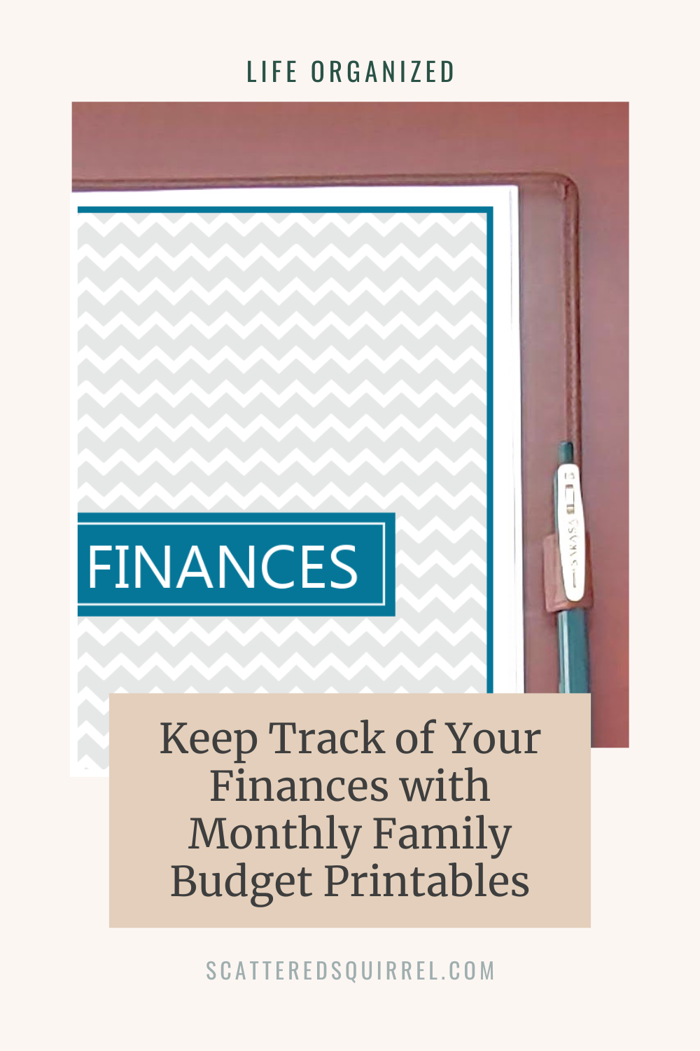 This image is a large, light sand coloured rectangle in portrait orientation. "Life Organized" is written at the top in dark green text. Below that is a photo of the top right two thirds of a planner which is lying on a wooden desk. The page on the planner shows a title page. It's got a blue border surrounding a light grey chevron background. In the center of the page is a blue lable with white text that says "Finances". Under the photo is a tan box with dark grey title text that says, "Keep Track of Your Finances with Monthly Family Budget Printables"