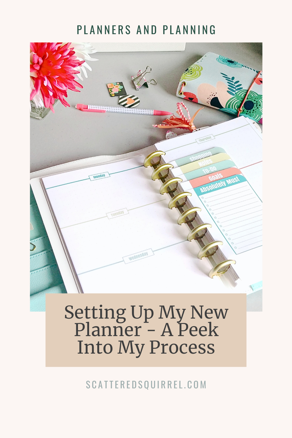 This image is a pale tan rectangle in portrait orientation. at the very top, in small, dark lettering it says "Planners and Planning". Under that is a picture of the top of a desk. On the desk from left to right, top to bottom are: a cut glass vase with pink and white flowers, a white polka dot pencil with pink ends, some small magnetic page markers, a floral patterned cloth traveler's notebook, and a disband planner lying open. The pages on the planner are a horizontal week on two pages, with a stack of lists bound between the pages. Below that is a tan box with dark text that says "Setting Up My New Planner - A Peek Into My Process