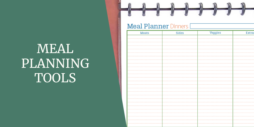 A meal planner for planning dinners by course is sitting in a planner on a desktop.